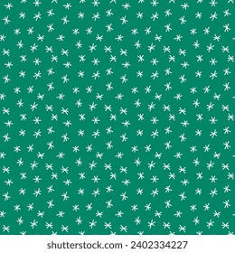 Seamless pattern with snowflakes on a green background