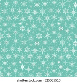 Seamless pattern with snowflakes on green mint color background. Can be used for wallpaper, pattern fills, textile, web page background, surface textures