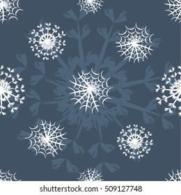 Seamless pattern of snowflakes on a grey background