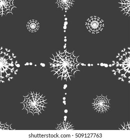 Seamless pattern of snowflakes on a grey background