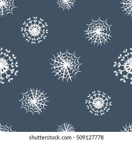Seamless pattern of snowflakes on a grey background