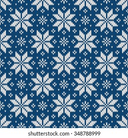 Seamless pattern from snowflakes on a knitted texture