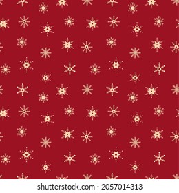 Seamless pattern with snowflakes on red background