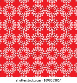 Seamless pattern of snowflakes, red background
