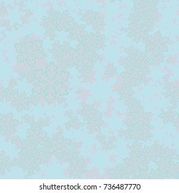 Seamless pattern. Snowflakes are scattered in disorder. New Year's background.