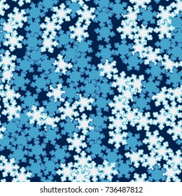 Seamless pattern. Snowflakes are scattered in disorder. New Year's background.