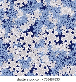 Seamless pattern. Snowflakes are scattered in disorder. New Year's background.