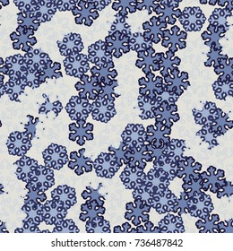 Seamless pattern. Snowflakes are scattered in disorder. New Year's background.