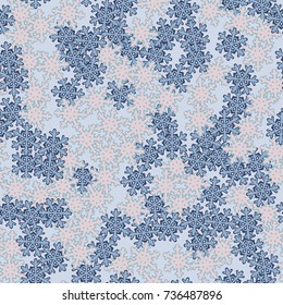 Seamless pattern. Snowflakes are scattered in disorder. New Year's background.