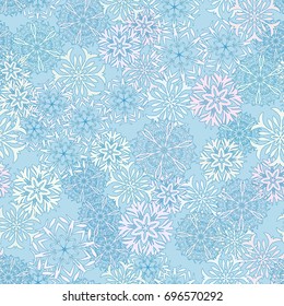 Seamless pattern. Snowflakes in white and blue shades.