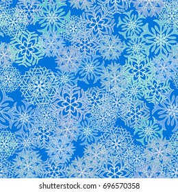 Seamless pattern. Snowflakes in white and blue shades.