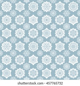 Seamless pattern with snowflakes. Winter blue wallpaper