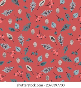 Seamless pattern with snowy fir tree branches, frozen leaves, berries on coral-color background. Winter holidays concept
