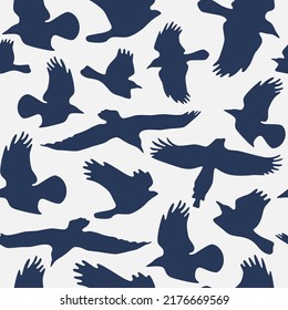 Seamless pattern with soaring birds silhouettes. Blue print on white background