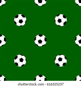 Seamless pattern with soccer balls on green background
