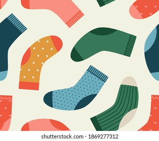 Seamless pattern of the socks in different colors and print. Hand-drawn set isolated on white background. Winter holidays concept. Christmas Stockings.