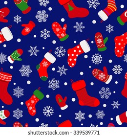 Seamless pattern of socks, mittens and snowflakes on blue background
