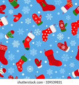 Seamless pattern of socks, mittens and snowflakes on light blue background