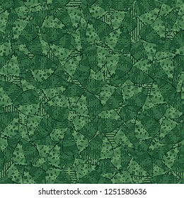 Seamless pattern. Speckled green leaves are randomly arranged against wavy lines. Camouflage style.