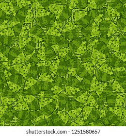 Seamless pattern. Speckled green leaves are randomly arranged against wavy lines. Camouflage style.