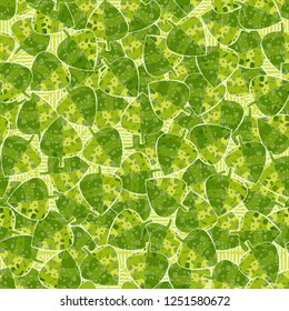 Seamless pattern. Speckled green leaves are randomly arranged against wavy lines. Camouflage style.