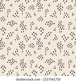 Seamless pattern with speckles for printing on gift wrapping paper and fabric. Monochrome cartoon flat vector background