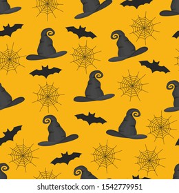 Seamless pattern of spider webs, bats and witches hats on a yellow background