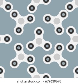 Seamless pattern from a spinner toy. Toy fidget to relieve stress. Vector illustration.