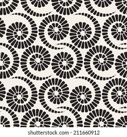 Seamless pattern with spiral curls. Vector repeating texture. Stylish background with scrolls