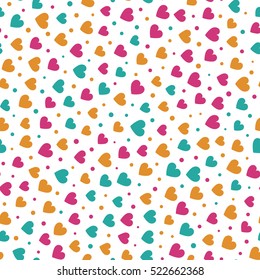 Seamless pattern with spring colored hearts and dots on a white background. Vector repeating texture. Perfect for printing on fabric or paper.