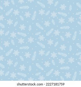 Seamless pattern of spruce branches and snowflakes. Light blue christmas background