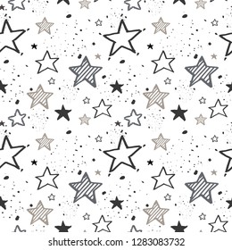 Seamless pattern of stars randomly arranged.