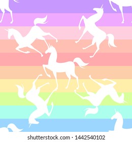 Seamless pattern with stilized unicorns. Colored illustration In pink, blue, ultraviolet colors
