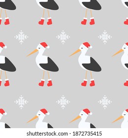 Seamless pattern stork with red hat and red shoes, snowflake and grey background.
Celebratory pattern for decorating gifts, fabrics and clothes for the New Year and Christmas.

