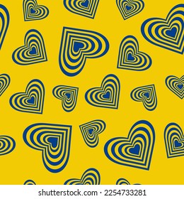 Seamless pattern of striped yellow and blue hearts on a yellow background