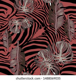 Seamless pattern of stripes of zebra, tiger and exotic leaves.