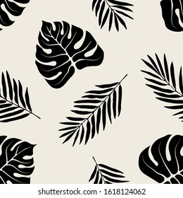 Seamless pattern with stylish monstera and fern leaves. Graphically natural print. Repeating monochrome texture.