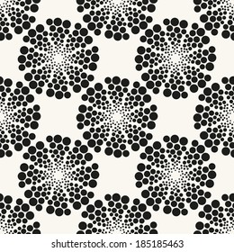 Seamless pattern with stylish spiral curls. Vector repeating texture. Modern print with circles from points