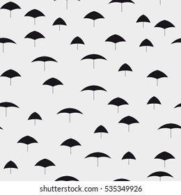 Seamless pattern. Stylish texture with monochrome umbrellas.