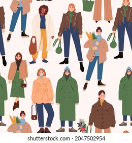 Seamless pattern with stylish women in trendy outfits. Fashionable spring or fall outfits. Street style models. Colored hand drawn vector illustration.