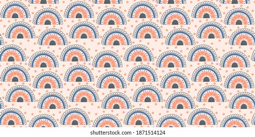 Seamless pattern of stylized rainbows decorated with stars in blue, soft pink and gray colors on a beige background. Texture for nursery wallpaper, teenage clothes, textile. Vector.