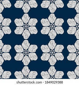 Seamless pattern. Stylized snowflakes, flowers or stars, white elements on a blue background. Ornate scrollwork. Hand drawn vector illustration