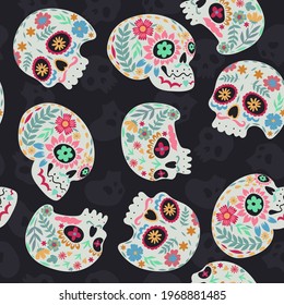 Seamless pattern of sugar skulls on a dark background. Vector graphics.