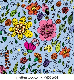 Seamless pattern of summer flowers on a blue background.