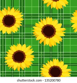 Seamless pattern with sunflowers on green tartan background. Vector illustration.