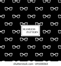 Seamless pattern with sunglasses. Hand drawn graphic fashion sketch. Black and white doodles background. Textile print, wrapping paper. Trend graphic glamour fashion seamless pattern in vogue style.