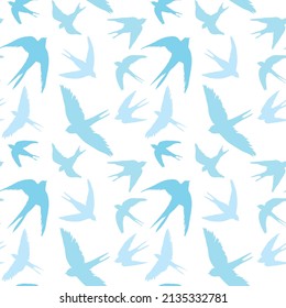 Seamless pattern of swallow silhouettes. Flying birds in different angles. An element of vector design.