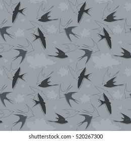 Seamless pattern with swallows flying in the clouds.
