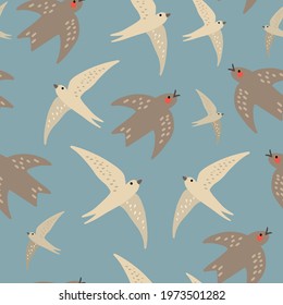 Seamless pattern with swallows and swifts birds on a blue background