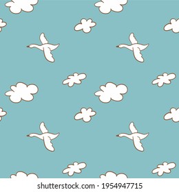 Seamless pattern swans fly among the clouds